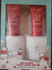 Foot care gift set with lotion, white slippers size 8, and a foot scrub. Image on box is polar bears dancing with colorful gift boxes.